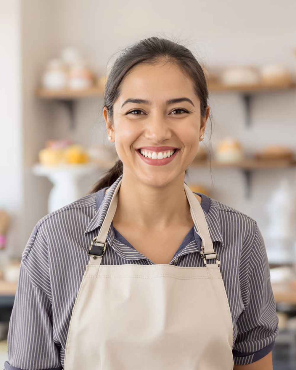 A UAE bakery owner at work in the shop